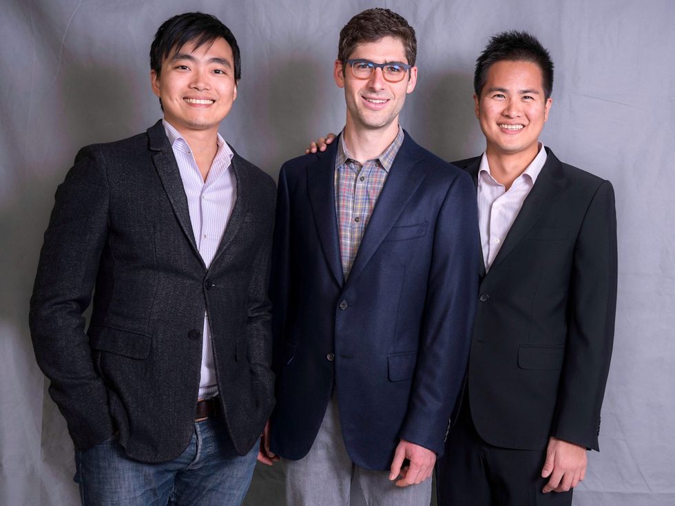 3 smiling men in suit jackets